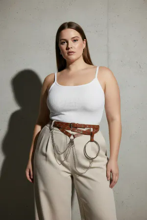 Brown Faux Leather Waist Harness with Draped Chains and O-Ring worn over a cream dress