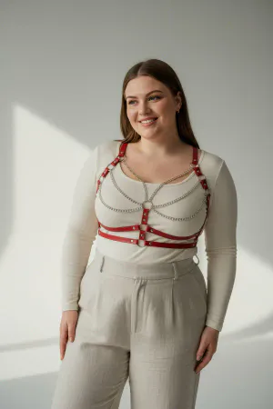 Red Faux Leather Chest Harness with Draped Chains Over White Tank Top