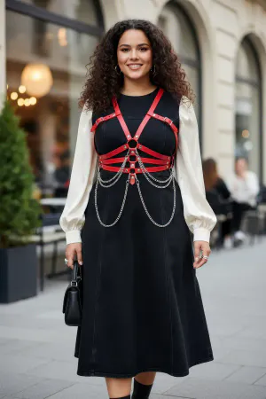 Red Faux Leather Chest Harness with Draping Chains Worn Over Dress