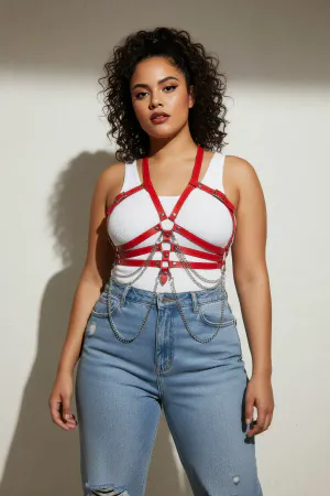 Red Faux Leather Chest Harness with Draping Chains Worn Over Dress